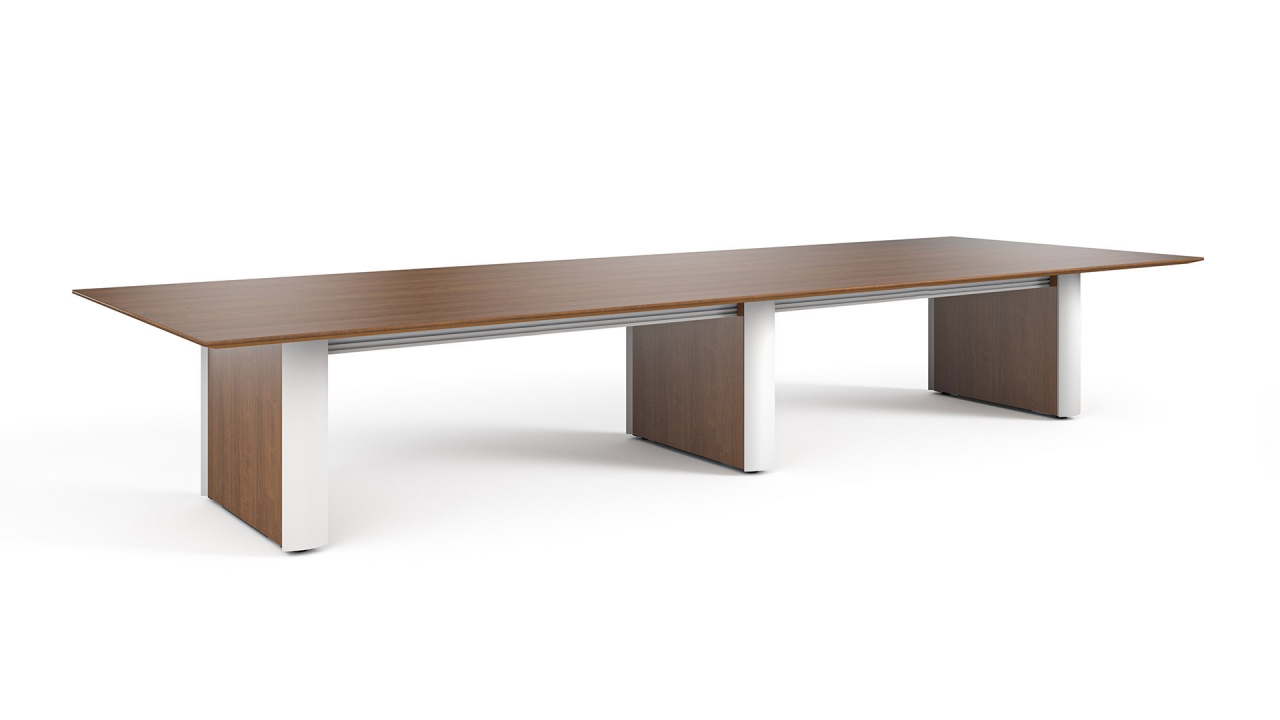 Camber conference table with curvilinear base in NYC meeting room