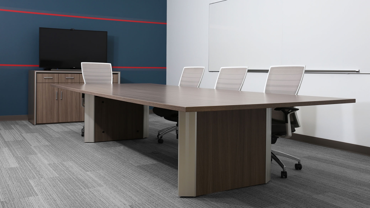 Stealth angular conference table with cable management in New York boardroom