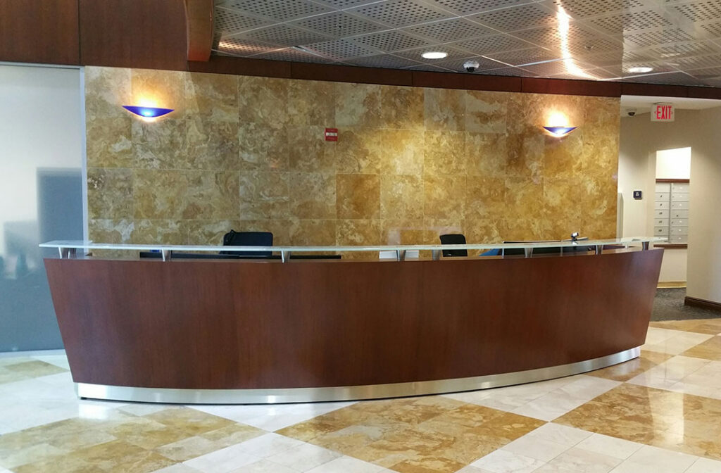 Rio reception desk with sculptural curve in a modern NYC lobby